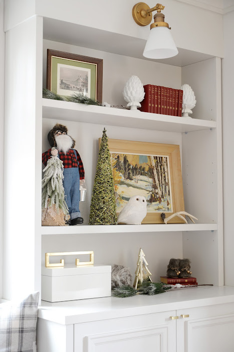 Grey swivel chairs. Christmas decor ideas. Living room decorated for Christmas