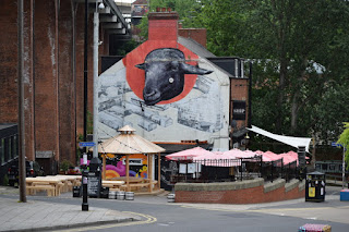 A mural depicting a Sheep's head on the side of The Ship Inn