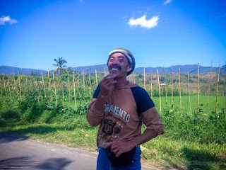 A Farmers Smile While Smoking On The Roadside Of The Village In The Agricultural Area