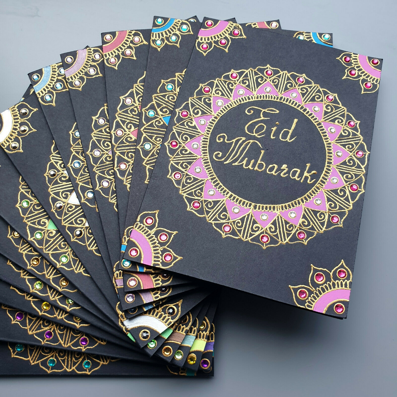 The specail messages is being written in the cards with the greeting of eid. 