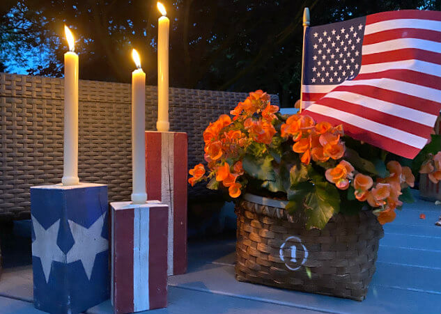American flag candle holders with lit candles