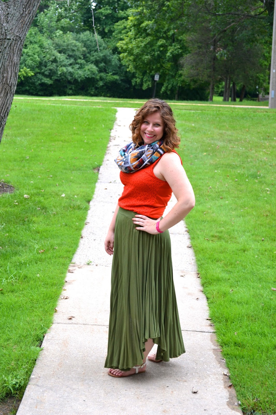 Whitney's outfit featuring a lace tank, olive maxi, and printed scarf