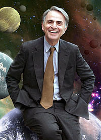 Carl Sagan leaning against the earth and smiling