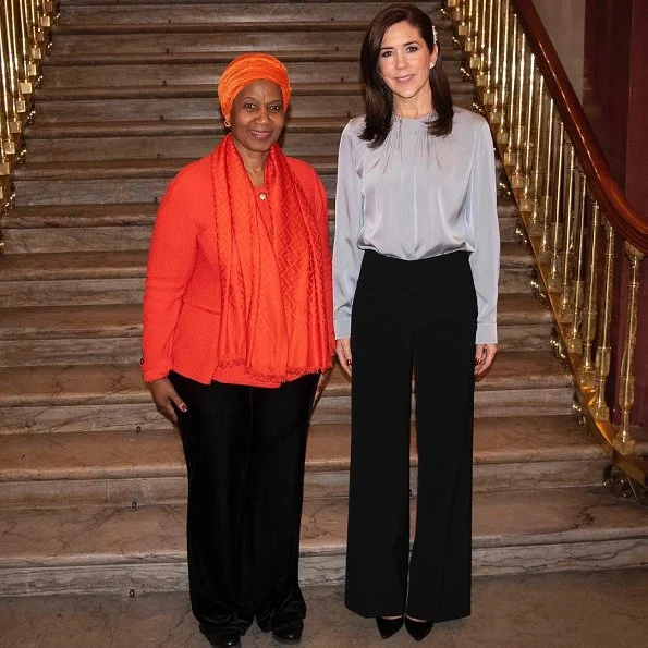 Crown Princess Mary wore Hugo Boss Banora Silk blend blouse.United Nations Under-Secretary-General and Executive Director of UN Women