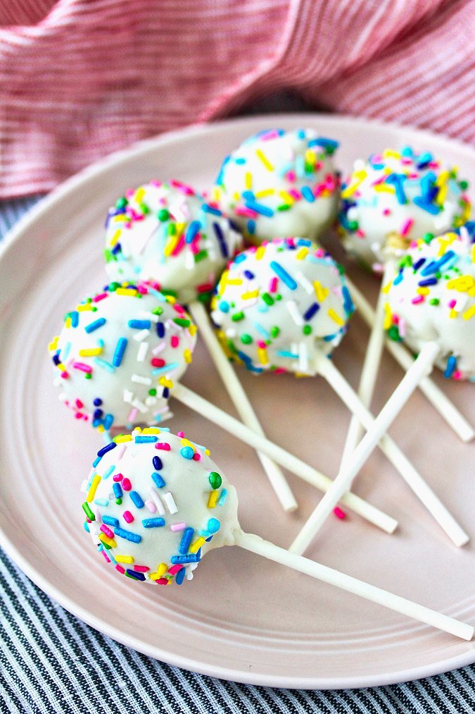 Birthday Cake Truffle Pops with sprinkles on a plate