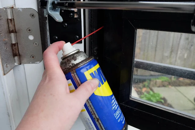 fixing storm door hinge squeak with WD40