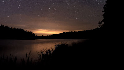 Screen background.  Evening night sky, stars, lake, sunset