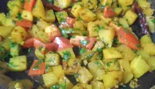 Cooked salgam ki sabzi with coriander leaves and tomato