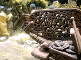 Detail of the carving on a one-twelfth-scale diorama of a maori waka (war canoe).