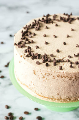 side and top view of a coffee and cream sponge cake with mini chocolate chips sprinkled on