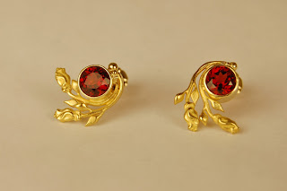red stones with two roses attached to each