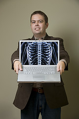Andy Beal standing in front of an x-ray machine ... being "transparent"