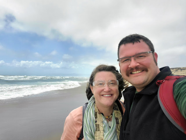 Image of us on a windy beach
