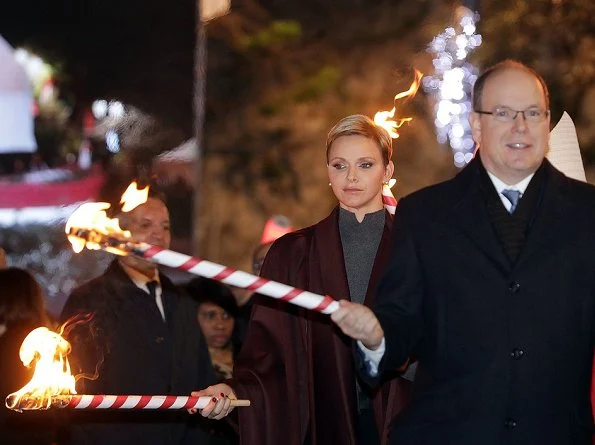 Princess Charlene and Prince Albert attend the traditional 2017 Sainte Devote procession in Monaco. Wore Akris cape