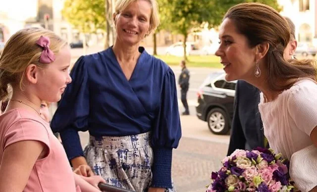 Crown Princess Mary wore a white dress by David Andersen, and snowdrop earrings by Dulong Fine Jewelry