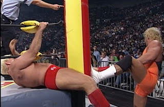 WCW Halloween Havoc 1997 - Curt Hennig attacks Ric Flair's knee using the ring post