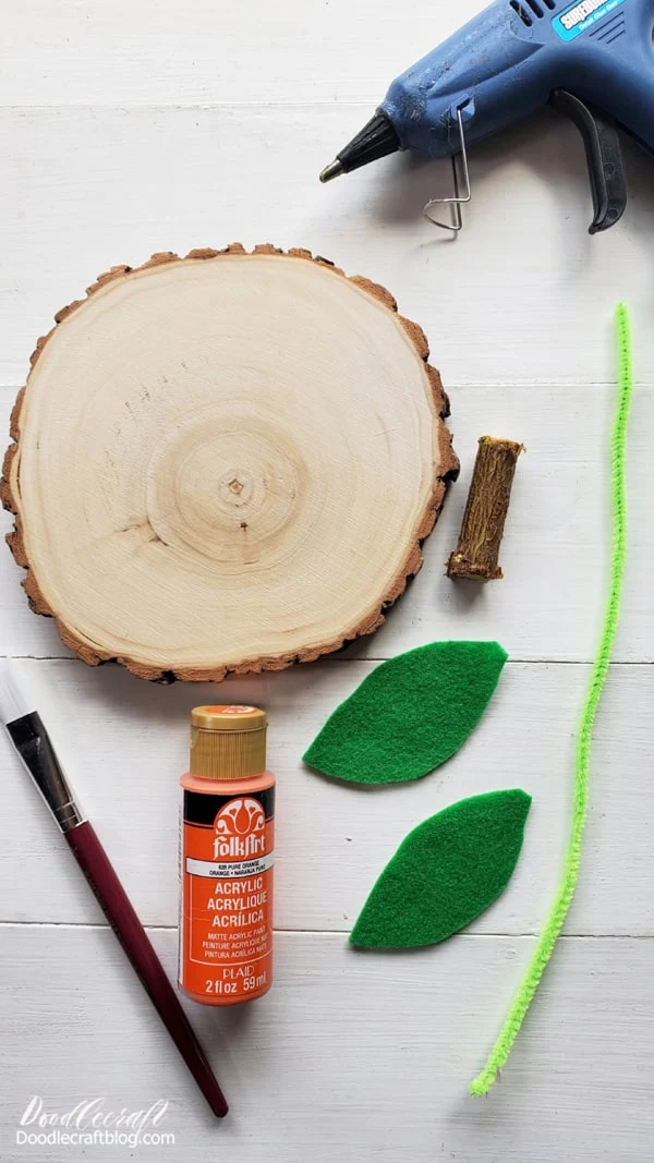 Supplies Needed for Wood Slice Pumpkin: Wood Slice Orange Craft Paint Tree Branch  Paintbrush Green Felt Green Pipe Cleaner Hot Glue/Gun Scissors