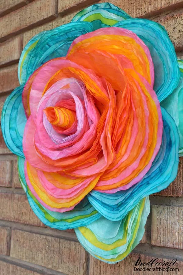 115 brightly colored layered coffee filters to make a giant 16 inch rose!