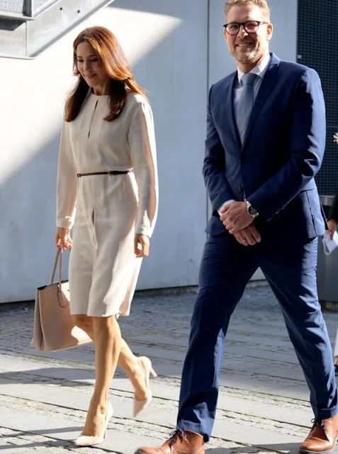 Crown Princess Mary wore a natural Lynne pleated silk dress from Joseph, Gianvito Rossi beige pumps, Dulong Delphis gold earrings