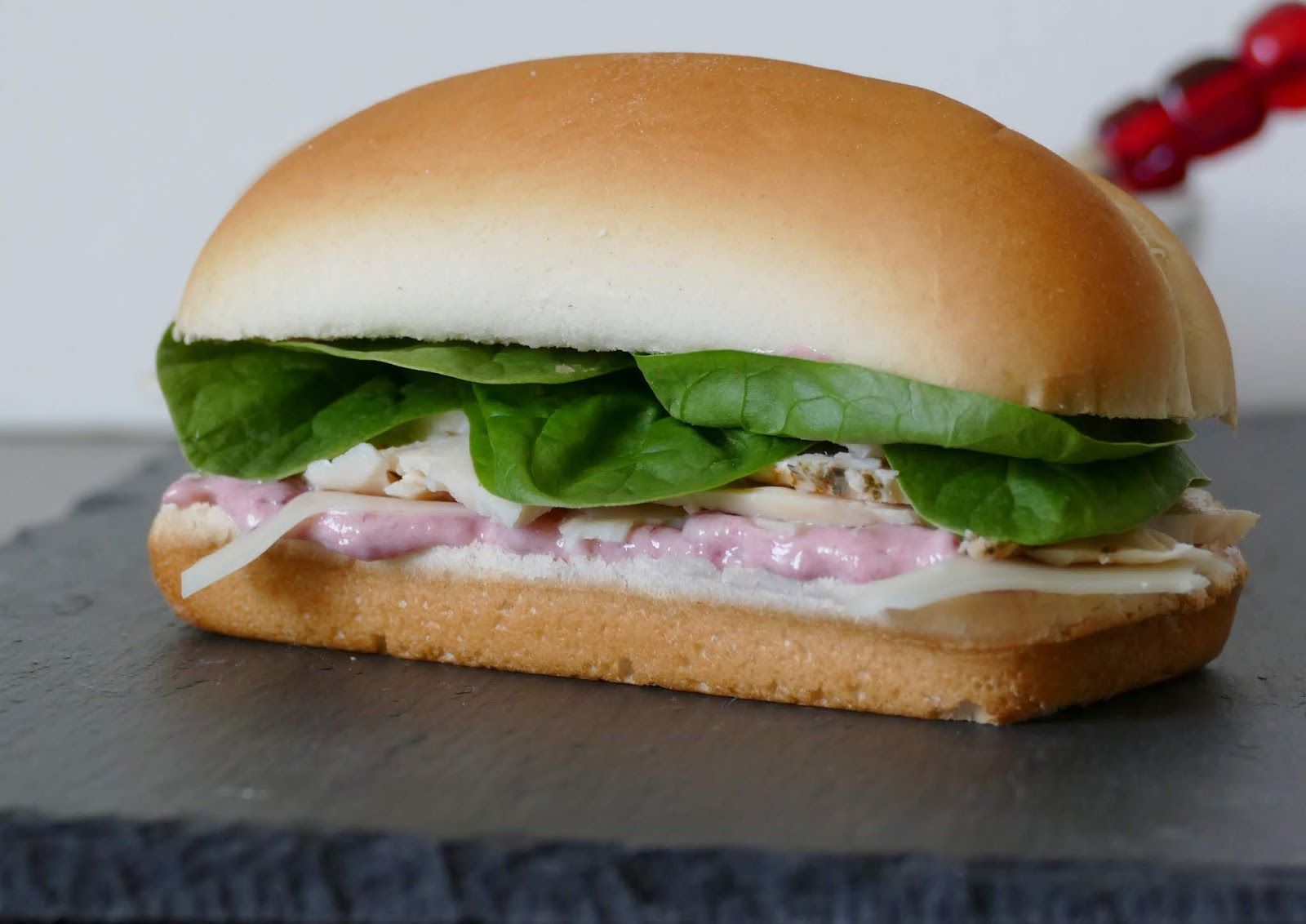 Use your leftover Thanksgiving or Christmas turkey, or deli turkey in this delicious sandwich! It's simple to make and tastes great with the cranberry mayo, spinach, turkey and swiss cheese! Make it for lunch or serve at your next game day party.