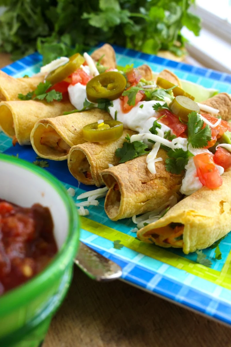 Air Fryer Chicken Taquitos have a crispy tortilla outside and a delicious, cheesy, salsa chicken inside.&nbsp; They make a great appetizer, main dish, or snack! #airfryer #chickenrecipe #taquitos