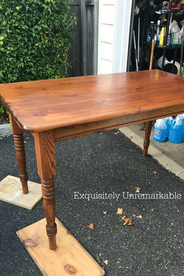 Stained Wooden Table outside in yard