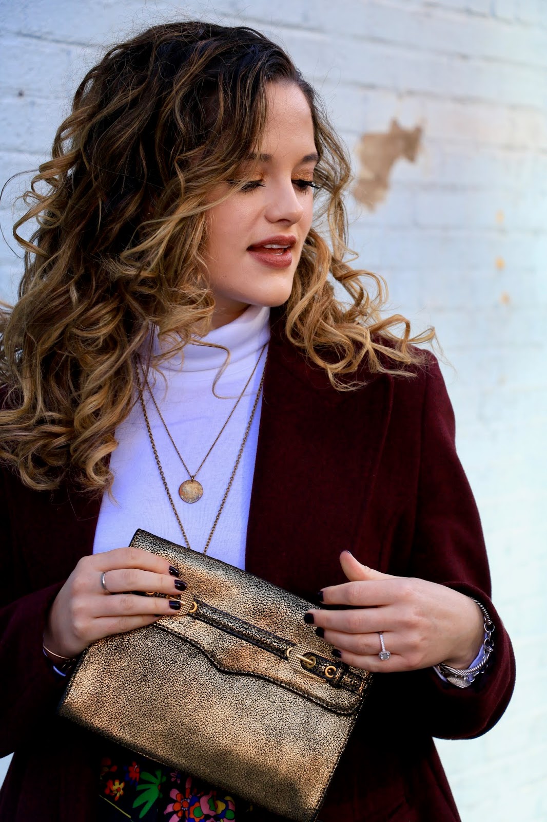 Nyc fashion blogger Kathleen Harper carrying a gold Rebecca Minkoff purse.