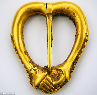 metal detector, gold brooch,  