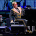  Elton John postpones his farewell tour for two years as he awaits hip surgery after fall.