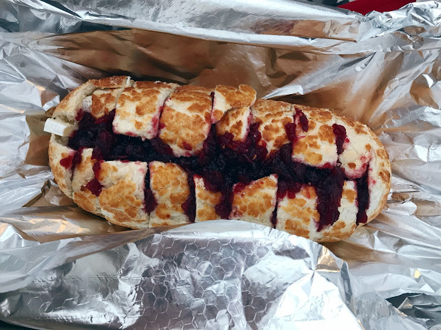Bread filled with brie and cranberry sauce