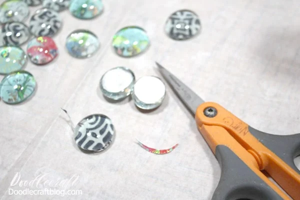 Use a small pair of scissors to trim the circles on the back so they are flush with the glass gems. This step is extra...I just like the finished product more if it the paper is flush to the glass gem.