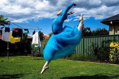 Edwina Pickles’ photo of Stephanie Kurlow shows her leaping in her backyard in a blue dress and hijab