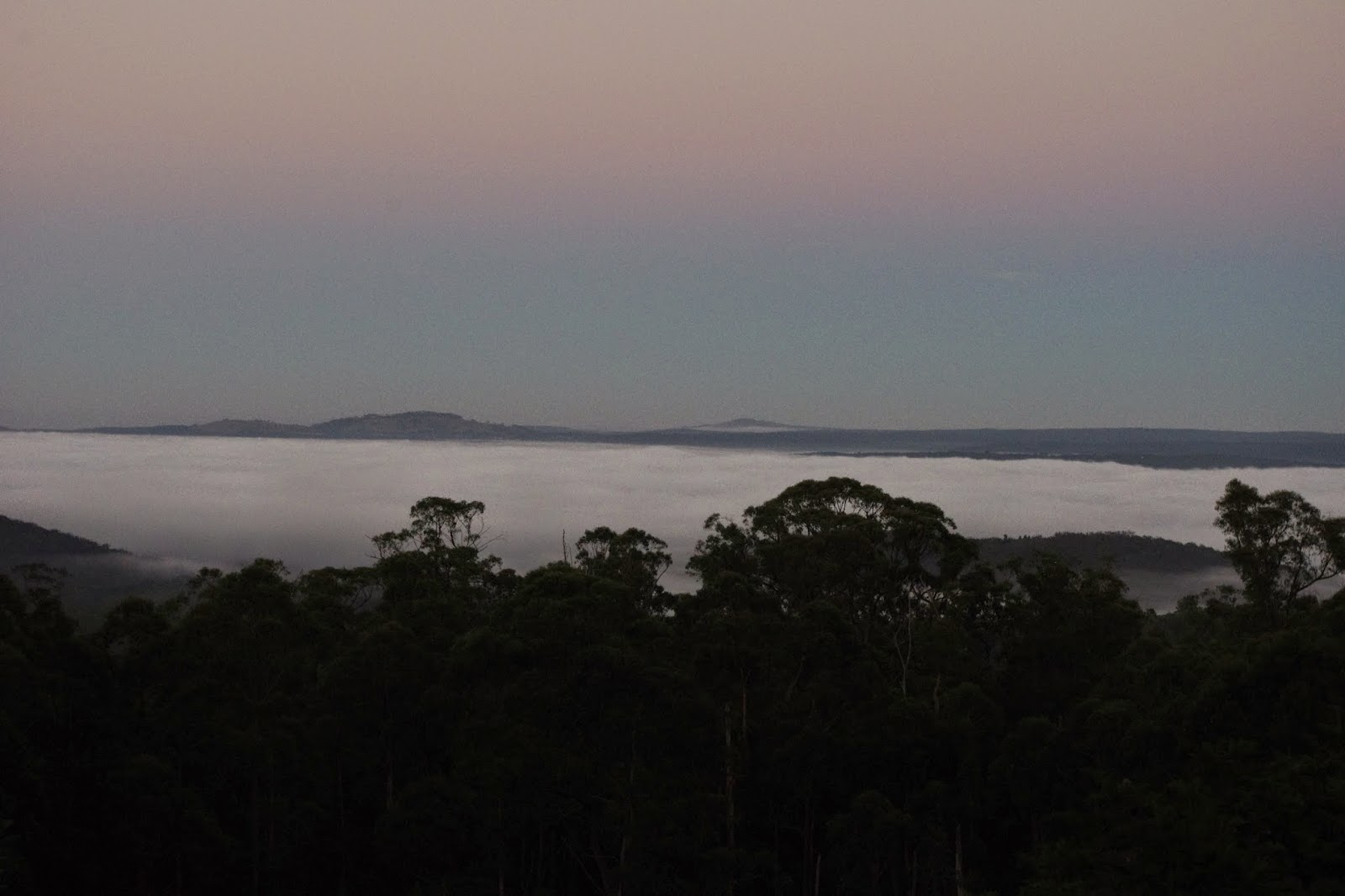 Fog and cold air move down hill into the valley below the farm