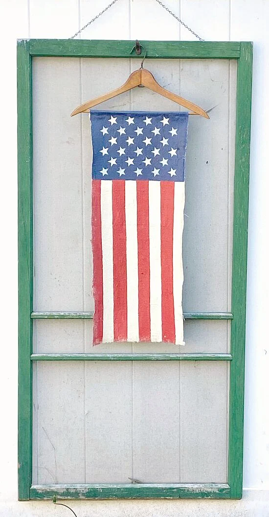 Vintage hanger with DIY Vertical American flag on a green screen door