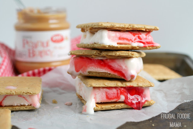 Two childhood favorites- peanut butter & jelly and ice cream sandwiches- come together in these easy to make 3 Ingredient PB&J Ice Cream Sandwiches.