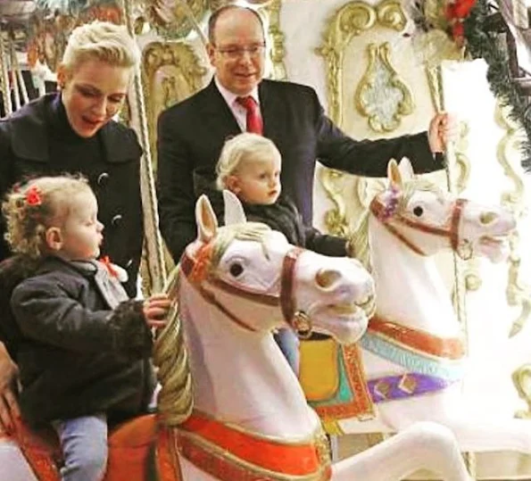 Princess Charlene, Princess Gabriella at opening the Monaco Christmas Village in Monaco. Style of Princess Charlene