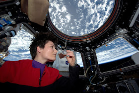 Cristoforetti, in the 'cupola' of the Space Station,  savours the first espresso brewed in space