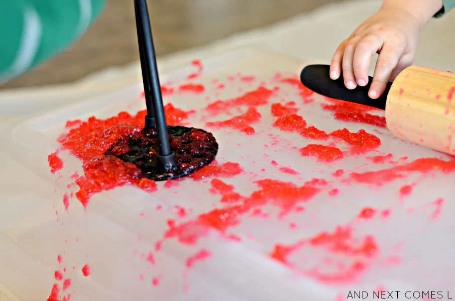 Fine motor gelatin heart-breaking sensory play for Valentine's Day from And Next Comes L