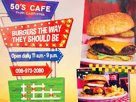 Cafe sign, hours of operation, burger images