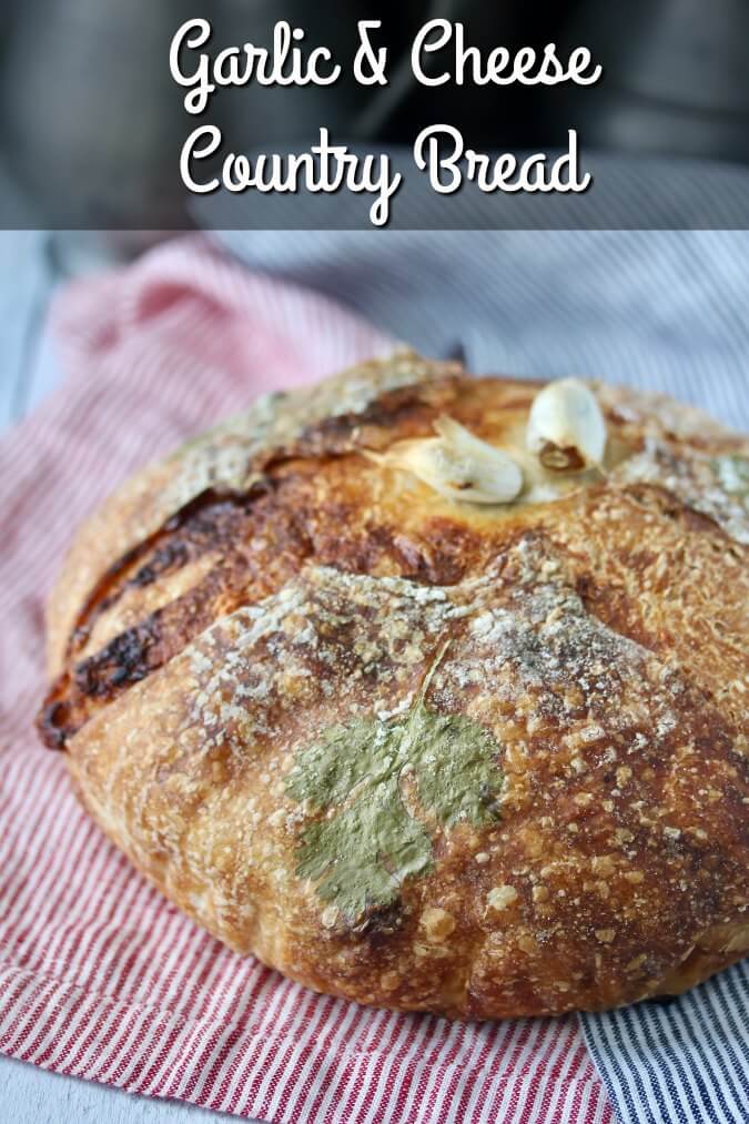 This Garlic Gruyere Pain de Campagne Boule is a big sourdough loaf with a swath of roasted garlic and cheese nestled right under the crust.
