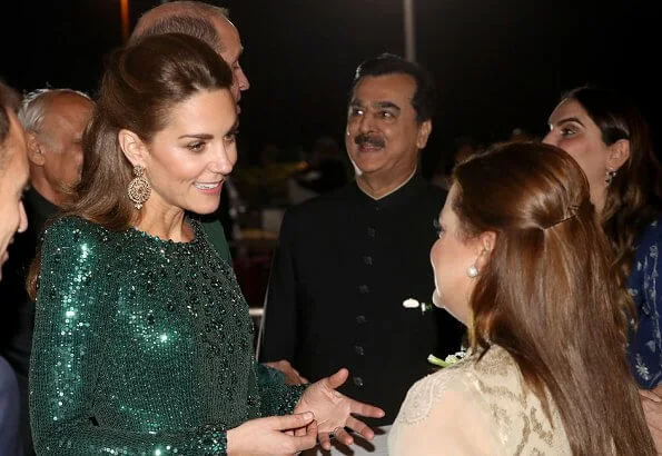 Kate Middleton wore a sparkling emerald green gown by Jenny Packham, and earrings by O'nita. Prince William wore a traditional Sherwani by Naushemian