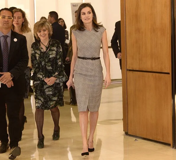 Queen Letizia carried Carolina Herrera black clutch. This year's event's theme is Bridging health and social care