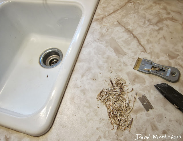 fixing a damaged sink, remove, caulk