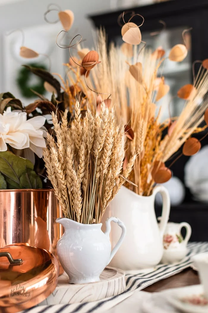natural dried wheat, grasses and leaves in vintage ironstone pitchers and copper canister