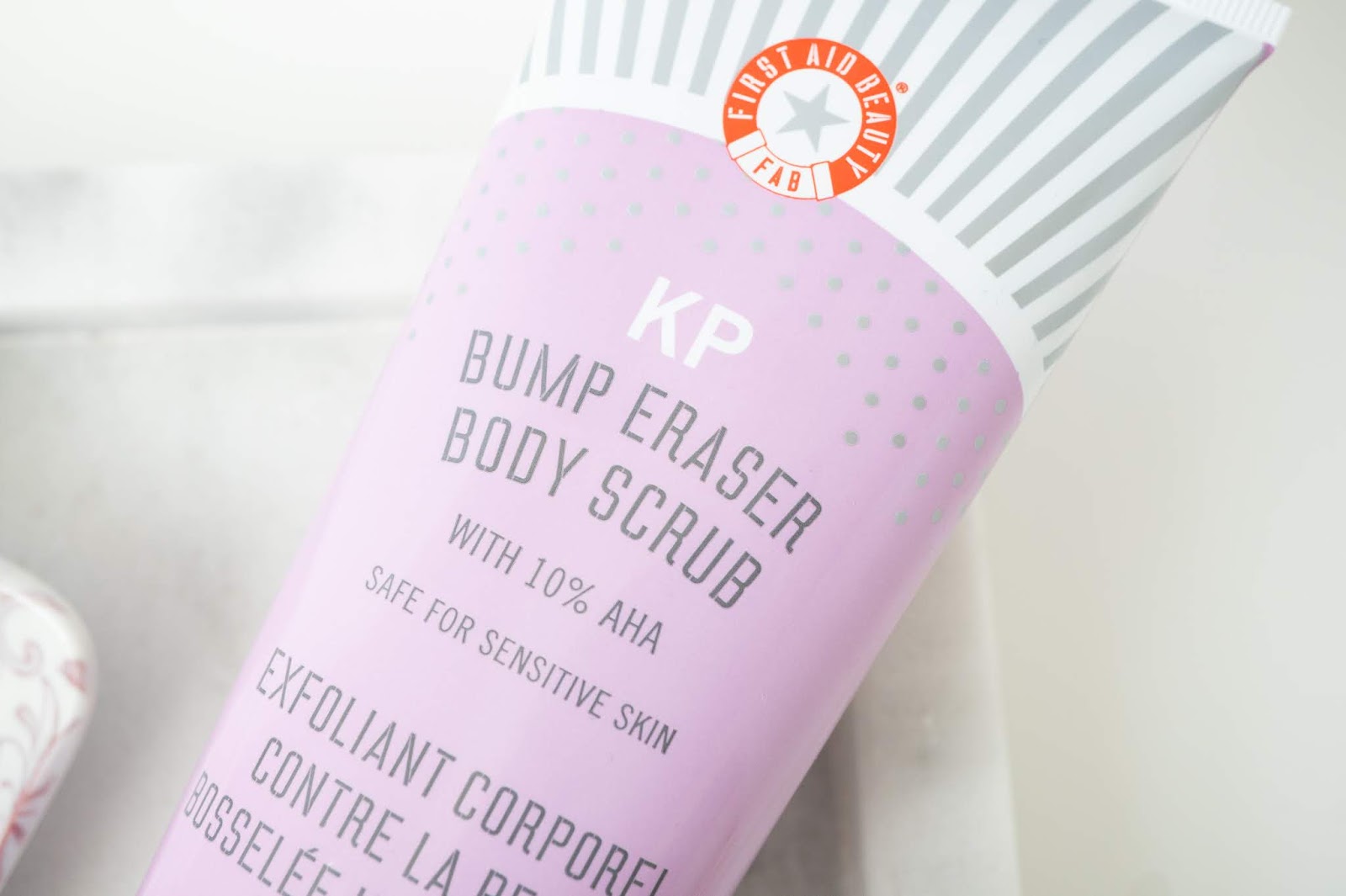 FIRST AID BEAUTY KP Bump Eraser Body Scrub with 10 AHA dazzle 'n