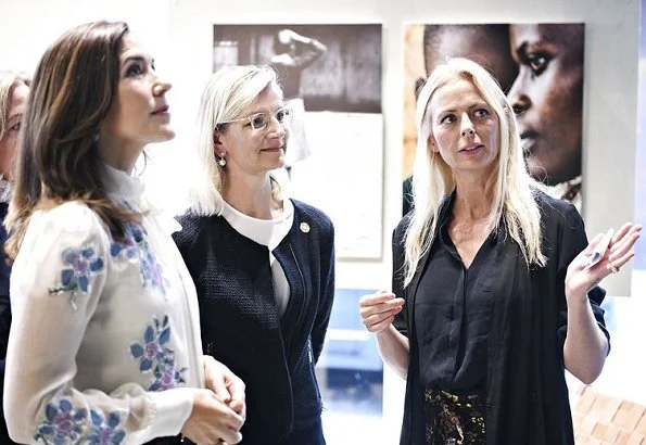 Crown Princess Mary wears Valentino Rockstud patent leather pumps. Photographer Signe Vilstrup portrait exhibition at Yume in Copenhagen