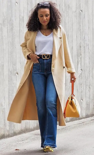 a coat with flare jeans.