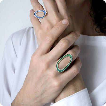 two silver and hand painted paper rings in blue and green