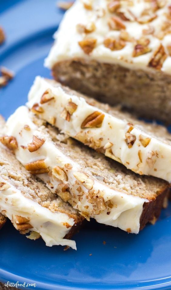 This easy hummingbird bread recipe is full of the flavors of the classic southern cake! This simple quick bread recipe is filled with sweet flavor, and is topped with the best cream cheese frosting! Hummingbird bread, similar to hummingbird cake, is a sweet coconut banana bread recipe on steroids all topped with a homemade cream cheese frosting. #bread #dessert #creamcheese #frosting