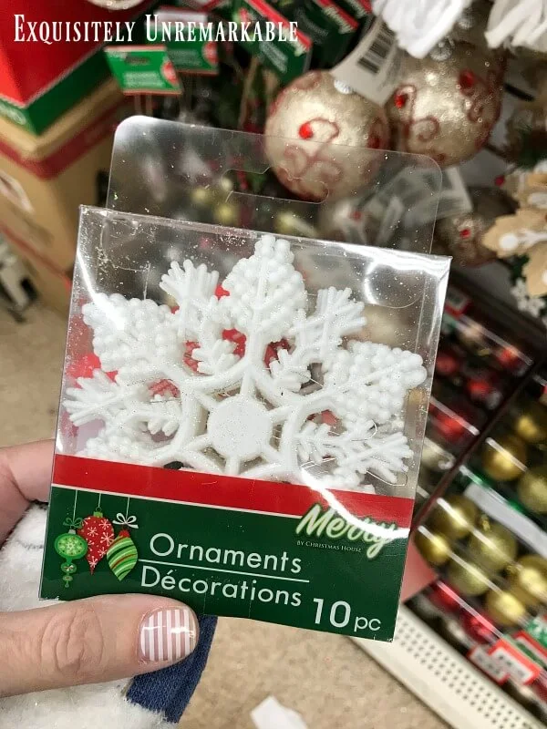 Dollar Store White Snowflake Ornament package in hand